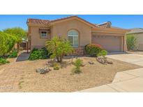 Charming single-Gathering home featuring a well-manicured desert landscape and a two-car garage at 14333 W Alvarado Dr, Goodyear, AZ 85395