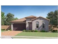 Charming single-story home featuring a tile roof, a two-car garage, and a well-maintained lawn at 15883 W Winslow Ave, Goodyear, AZ 85338