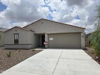 Charming single-story home featuring a clean desert landscape and a neutral color palette at 18361 E Eloisa Dr, Gold Canyon, AZ 85118