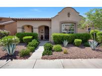 Charming single-story home featuring a well-manicured yard and inviting front entrance at 20699 W Ridge Rd, Buckeye, AZ 85396
