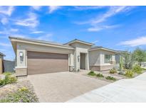 Charming single-story home featuring desert landscaping, neutral color palette, and a two car garage at 22218 N 28Th St, Phoenix, AZ 85050