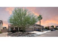 Charming home featuring a well-manicured yard, desert landscaping and tile roof at 351 N Newport St, Chandler, AZ 85225