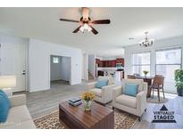 Bright living room features neutral tones, open floor plan, and stylish furnishings at 3514 S Posse Trl, Gilbert, AZ 85297