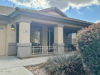 Inviting front porch with decorative columns and seating area, perfect for relaxing outdoors at 3891 E Simpson Rd, Gilbert, AZ 85297