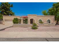 Charming single-story home with a well-maintained stucco exterior and inviting curb appeal at 400 W Crofton St, Chandler, AZ 85225