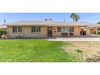 Charming single-story home features a well-maintained front yard with mature landscaping at 6255 E Rose Circle Dr, Scottsdale, AZ 85251