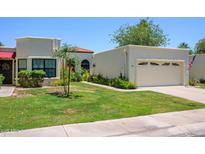 Charming single-story home with a well-maintained lawn, attached garage, and neutral stucco exterior at 7635 S Taylor Dr, Tempe, AZ 85284