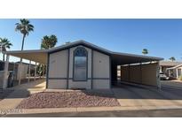 Manufactured home featuring covered parking at 9302 E Broadway Rd # 129, Mesa, AZ 85208