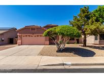 Charming single-Gathering home featuring a two-car garage and desert landscaping at 11338 E Contessa St, Mesa, AZ 85207