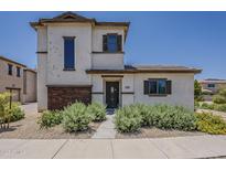 Charming two-story home features desert landscaping and a welcoming front entrance at 2540 N 148Th Dr, Goodyear, AZ 85395
