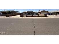 Charming single-story home featuring a well-maintained front yard and inviting curb appeal at 2745 E Wood St, Phoenix, AZ 85040