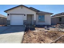 Charming single-story home with stucco siding, attached garage, stone accents and tile roof at 32016 N Pony Express Rd, San Tan Valley, AZ 85143