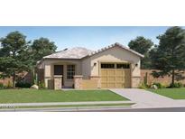 Charming single-story home with a two-car garage, well-maintained lawn, and inviting curb appeal at 36600 W Maddaloni Ave, Maricopa, AZ 85138
