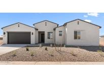 Charming single-story home with a gravel front yard, desert landscaping, and a two-car garage at 37695 W Santa Maria St, Maricopa, AZ 85138