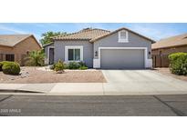 Charming single-story home with a well-manicured yard and a two-car garage at 4231 E Augusta Ave, Chandler, AZ 85249