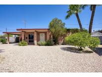 Charming single-story home featuring well-kept landscaping and classic desert style features at 12220 N 22Nd Pl, Phoenix, AZ 85022