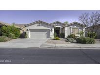 Charming single-story home featuring desert landscaping and a two-car garage, perfect for curb appeal at 2512 E Katrina Trl, Casa Grande, AZ 85194