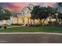 Stunning two-story home featuring a lush lawn, manicured landscaping, and a welcoming front porch at 2625 N 24Th St # 15, Mesa, AZ 85213