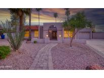 Charming single-story home featuring a red tile roof, desert landscaping, and a cozy, inviting facade at sunset at 3204 N Jay St, Chandler, AZ 85225