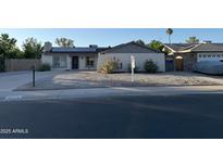 Charming single-story home with desert landscaping, solar panels and a welcoming entryway at 3734 W Dailey St, Phoenix, AZ 85053