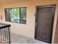 Exterior shot of unit entry featuring a steel security door and window at 3810 N Maryvale Pkwy # 2077, Phoenix, AZ 85031