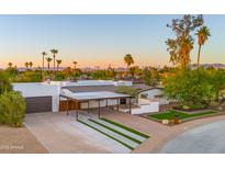 Stunning desert home with a long driveway, carport, and gorgeous mountain views at 4040 E Becker Ln, Phoenix, AZ 85028