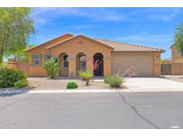 Charming single-story home with a well-maintained front yard and a neutral-colored facade at 40479 W Marion May Ln, Maricopa, AZ 85138