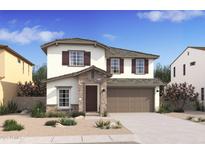 Charming two-story home with stone accents, attached two-car garage, and landscaped front yard at 7327 S 76Th Ln, Laveen, AZ 85339