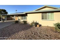 Charming home with a cozy front porch and well-maintained landscaping with brick exterior at 9615 N 34Th Ave, Phoenix, AZ 85051