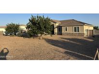 Charming single-story home with low maintenance desert landscaping and beautiful curb appeal at 9759 E Brown Rd, Mesa, AZ 85207