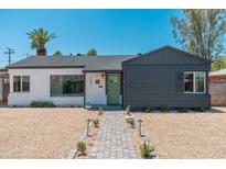 Charming home featuring a lovely brick pathway and a modern, two-toned exterior design at 1621 W Mulberry Dr, Phoenix, AZ 85015
