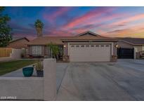Charming single-story home boasting a spacious driveway and two-car garage in a well-maintained neighborhood at 1814 N 89Th Ave, Phoenix, AZ 85037