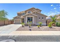 Charming two-story home with a well-maintained landscape, a two-car garage and a front yard at 25837 W Watkins St, Buckeye, AZ 85326