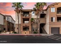 Beautiful condo building with desert landscaping, balconies, and attractive architectural details at 5302 E Van Buren St # 2024, Phoenix, AZ 85008