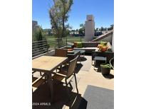 Inviting patio with comfortable seating and views of the golf course at 7222 E Gainey Ranch Rd # 232, Scottsdale, AZ 85258