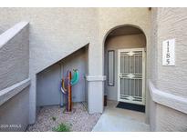 Inviting front entrance with decorative cactus and security door at 15225 N 100Th St # 1185, Scottsdale, AZ 85260