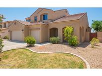 Charming home featuring a desert-landscaped front yard and attached two-car garage at 278 S San Luis Rey Trl, Casa Grande, AZ 85194