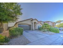 Charming single-story home with a two-car garage and well-maintained landscaping at 29384 N Rosewood Dr, San Tan Valley, AZ 85143
