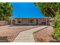 Charming single-story home featuring a covered entryway and low-maintenance landscaping in a desirable neighborhood at 544 S Crismon Rd, Mesa, AZ 85208