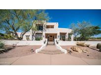 Stunning two-story home featuring desert landscaping, stucco exterior, and a private gated entryway at 8540 E Mcdowell Rd # 116, Mesa, AZ 85207