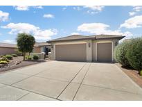 Charming single-story home with a three-car garage and meticulously maintained landscaping at 26247 W Lone Cactus Dr, Buckeye, AZ 85396