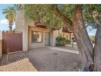 Charming townhome exterior with gravel landscaping and private balcony on a sunny day at 2815 N 52Nd St # 3, Phoenix, AZ 85008