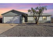 Charming single story home featuring an attached two-car garage and low maintenance landscaping at 3410 E Everett Dr, Phoenix, AZ 85032