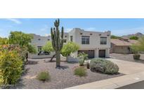 Southwestern home with desert landscaping, two-car garage, and mature trees at 3611 E Ahwatukee Dr, Phoenix, AZ 85044