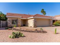 Charming home featuring desert landscaping, a red-tile roof, and a two-car garage at 925 W Hudson Way, Gilbert, AZ 85233