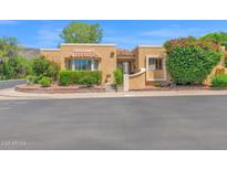 Charming home featuring well-manicured landscaping and a welcoming facade with colorful flowers enhancing its curb appeal at 1040 E Clinton St, Phoenix, AZ 85020