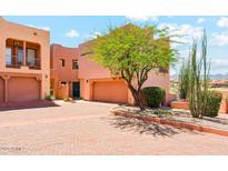 Inviting multi-level home with a desert-landscaped yard and a private two-car garage at 13227 N Mimosa Dr # 101, Fountain Hills, AZ 85268