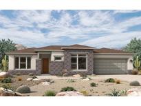 Stunning single-story home with desert landscaping and a brick-accented facade at 20633 W Berridge Ln, Buckeye, AZ 85396