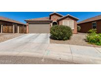 Charming single-story home with a well-maintained yard and a two-car garage at 2391 S 171St Ln, Goodyear, AZ 85338