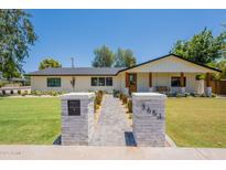Charming single-story home with a walkway and well-maintained lawn at 3651 N 49Th Pl, Phoenix, AZ 85018